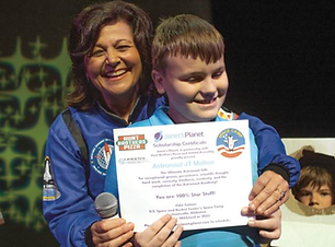 Student getting an award at astronaut academy